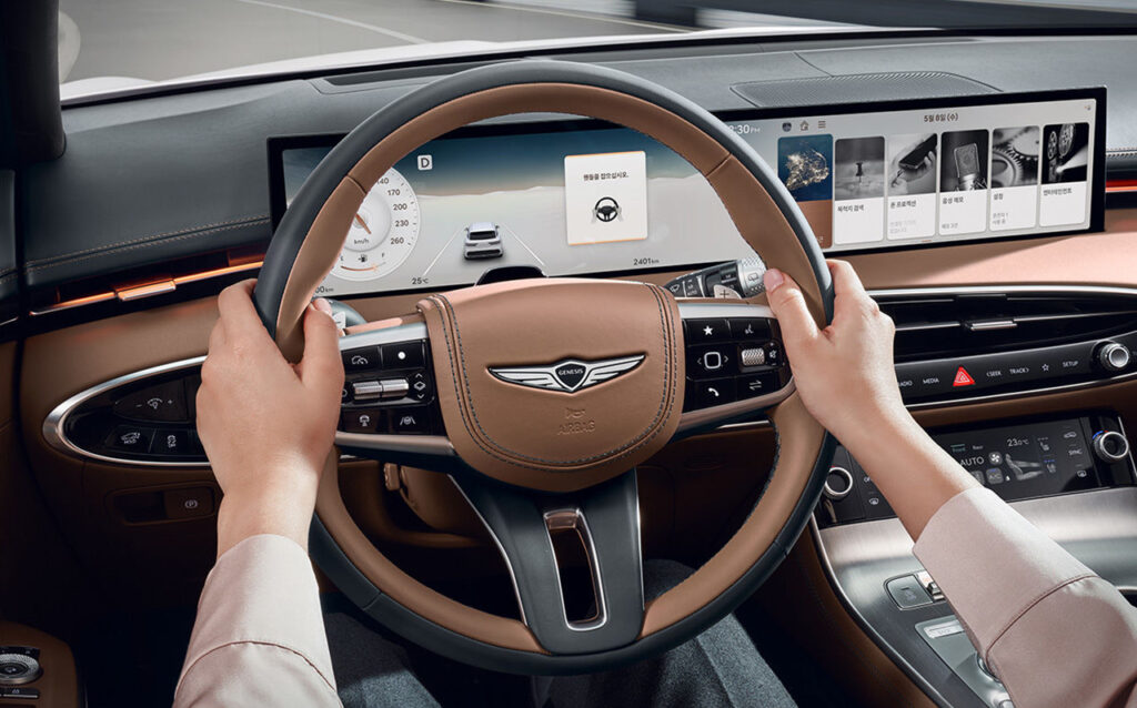 2025년형 GV70 실내 1열 핸들 브라운 시트사진